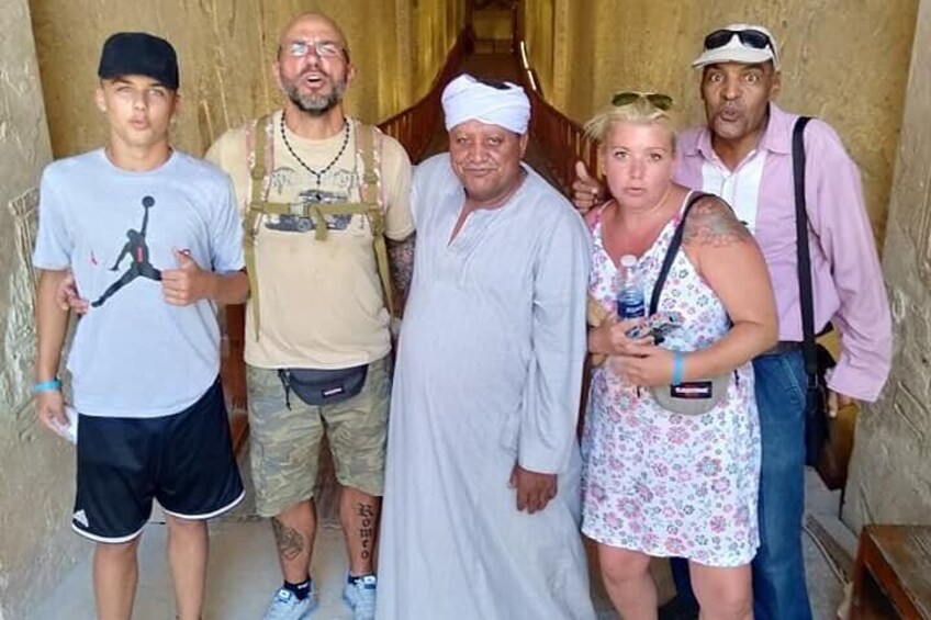 A group of people standing in a doorway. 1