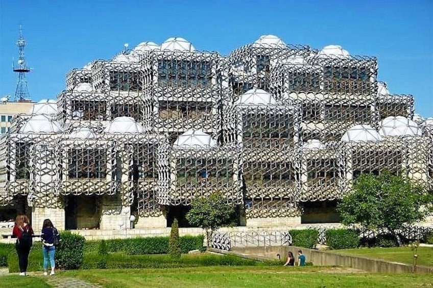 A large, ornate building with multiple domes and intricate latticework. 1