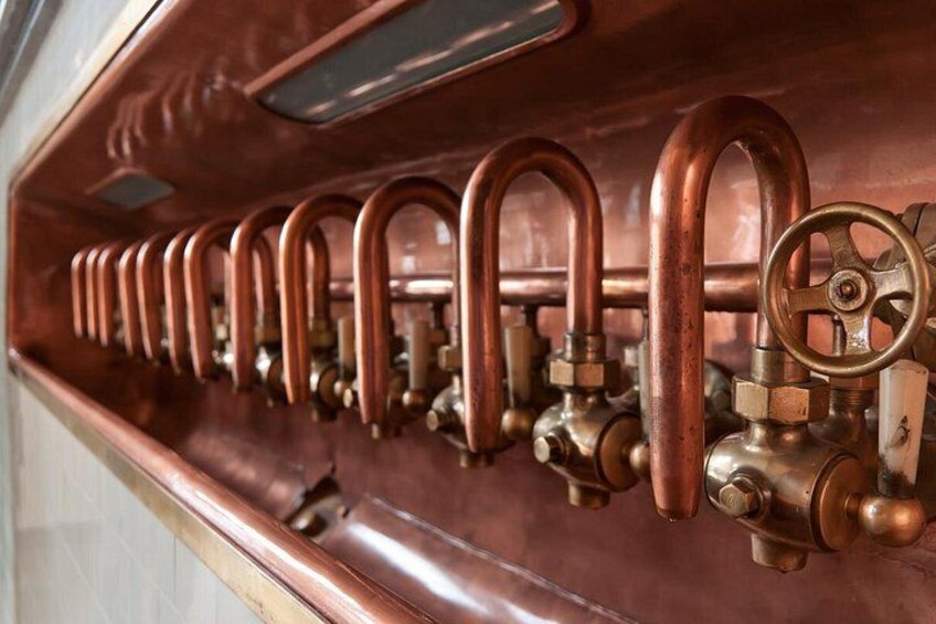 A row of copper pipes and valves. 2