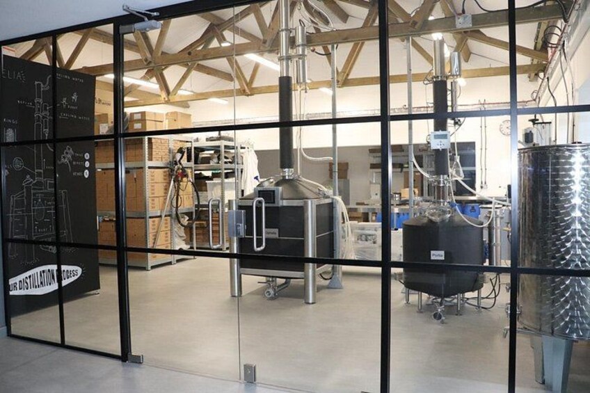 A distillation process in a glass-walled facility with industrial equipment. 2