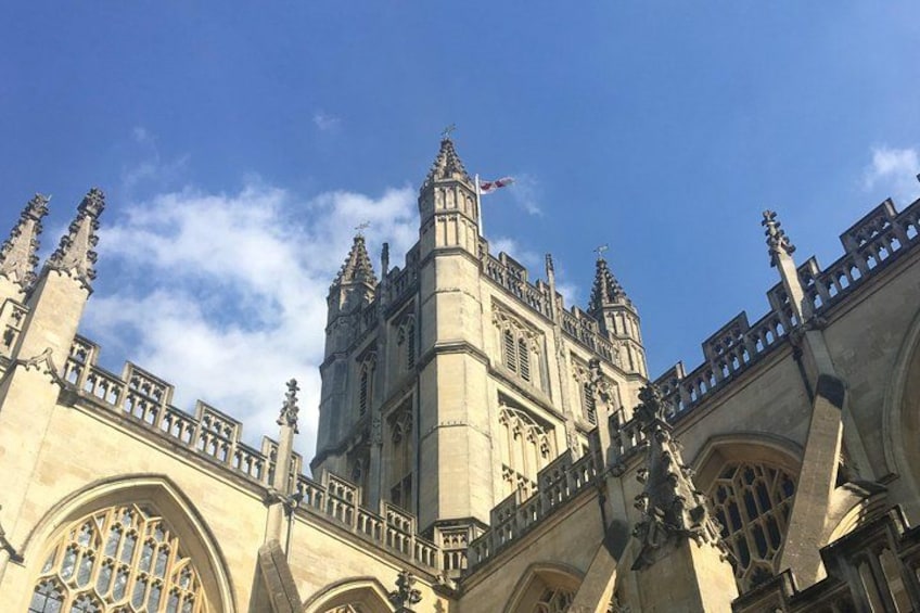 A historic building with intricate architecture, including pointed arches and detailed stonework. 3