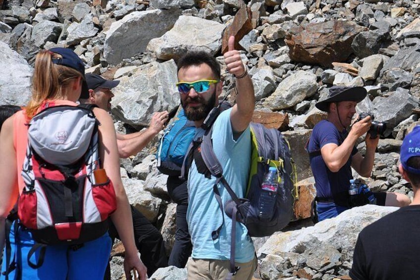 A group of hikers with backpacks and one person giving a thumbs-up. 5