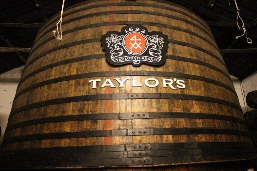 A wooden barrel with the label "TAYLOR'S" and a crest with the number "692". 5