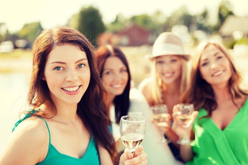 A group of people holding glasses, likely at a social gathering. 1