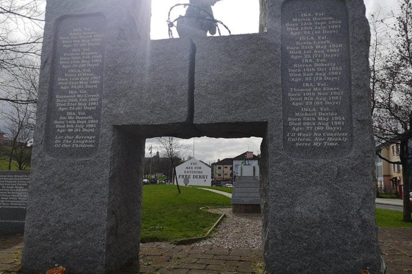 A stone monument with engraved names and dates. 4
