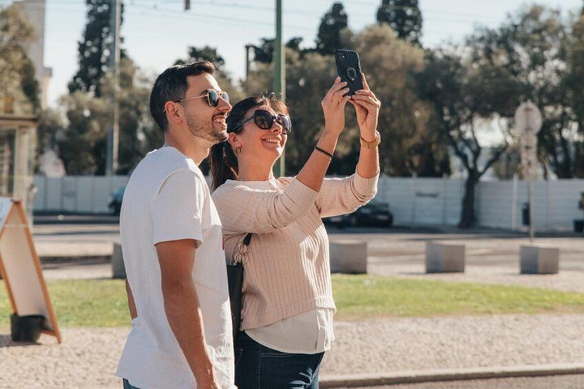 Two people taking a selfie with a smartphone. 4
