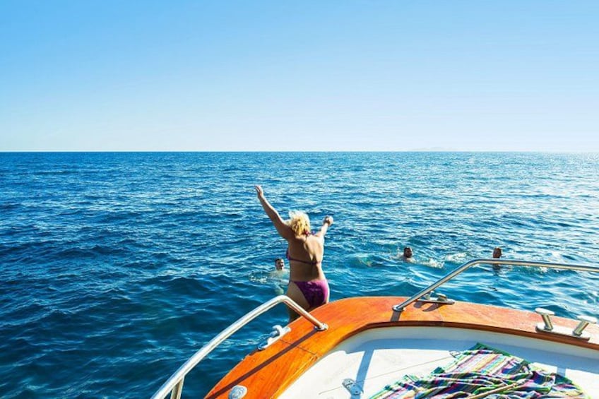 A person on a boat with the ocean in the background. 3