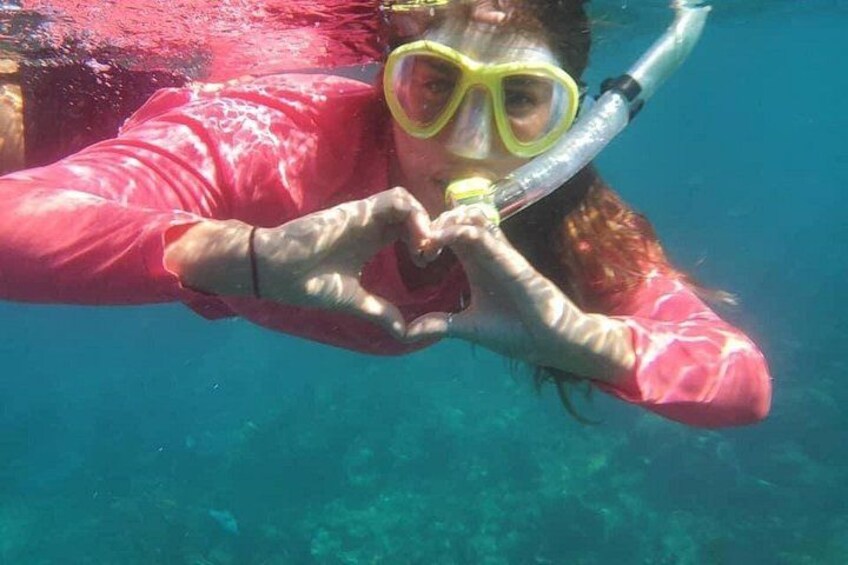 A person snorkeling underwater. 2