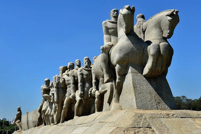 A large stone sculpture of soldiers on horseback. 4