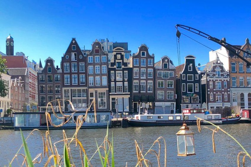 Leaning canal houses on the Amstel river 1