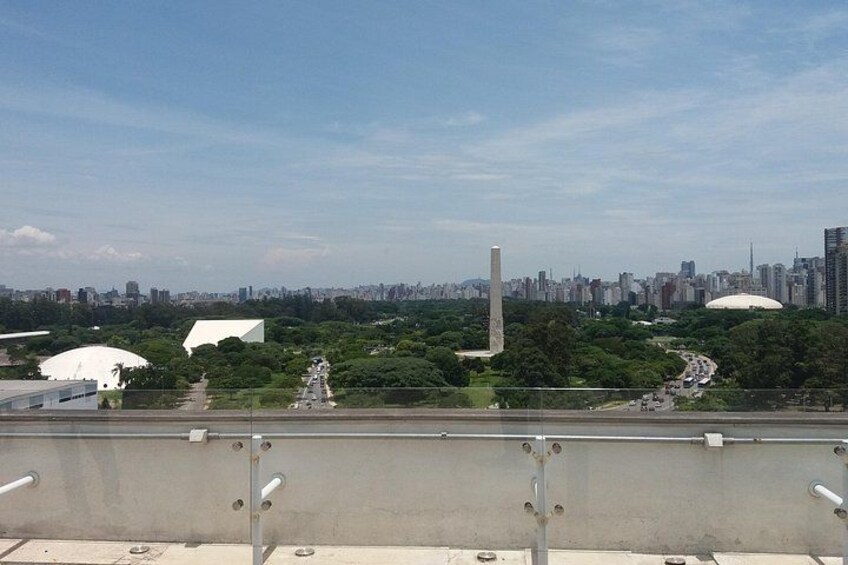 A cityscape with a monument, a large dome, and a tall tower. 4