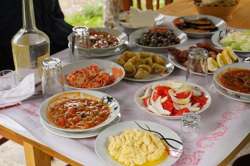 A table with various dishes, including pasta, salads, and a plate of scrambled eggs. 2