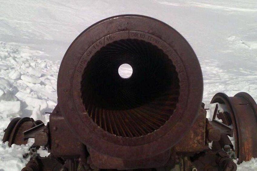 A rusty cannon in a snowy landscape. 3