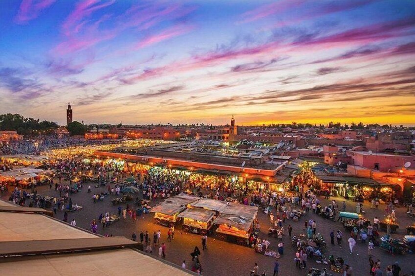 A bustling market with numerous stalls and people. 5