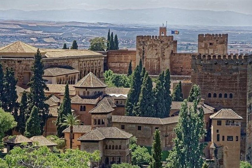 A historic city with medieval architecture, including a prominent castle and fortified walls. 2