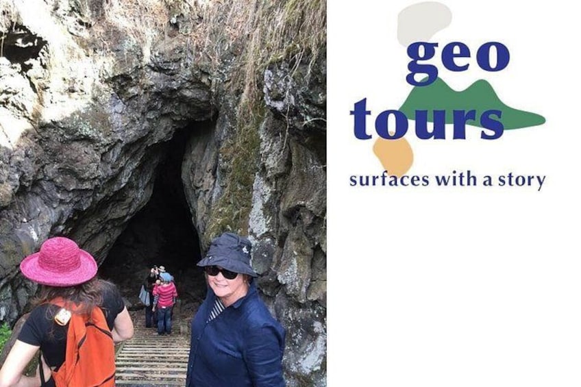 A cave entrance with people exploring. 5