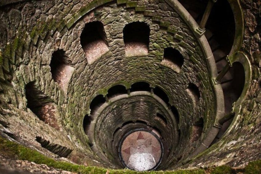 A spiral stone staircase inside a tower. 4