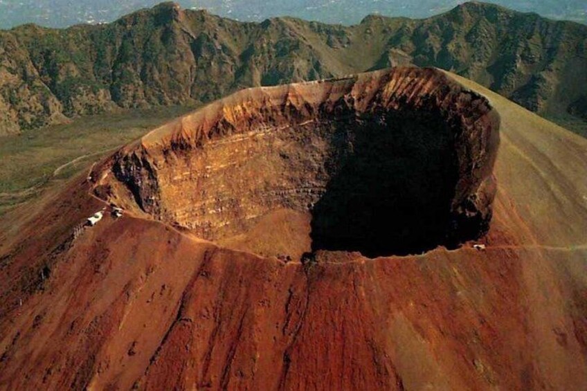 A large crater surrounded by mountains. 3