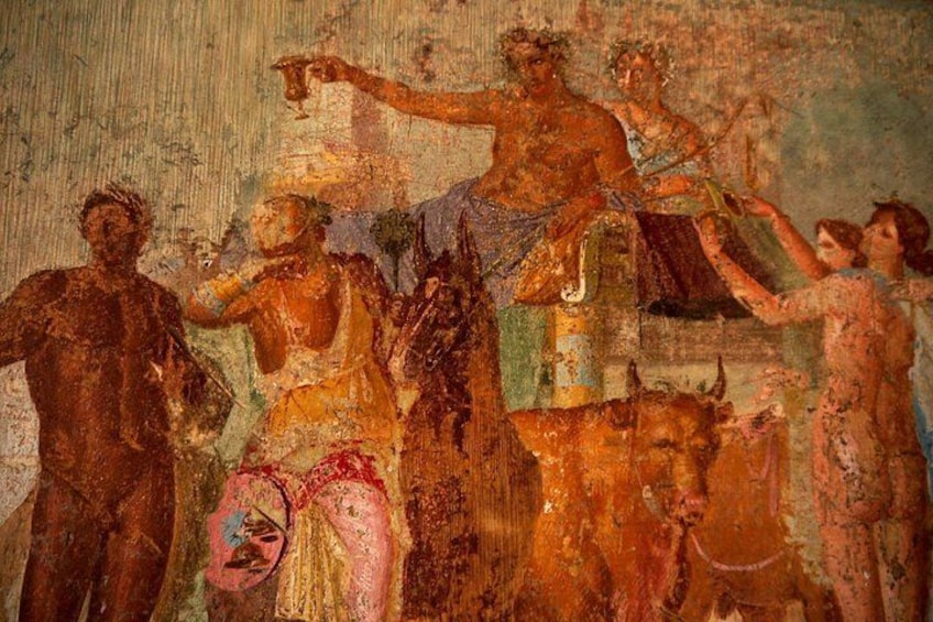 Une fresque représentant des personnages vêtus de costumes d’époque, un cheval et un taureau. 5