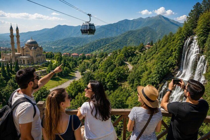 A group of people on a cable car overlooking a waterfall and a mosque. 1