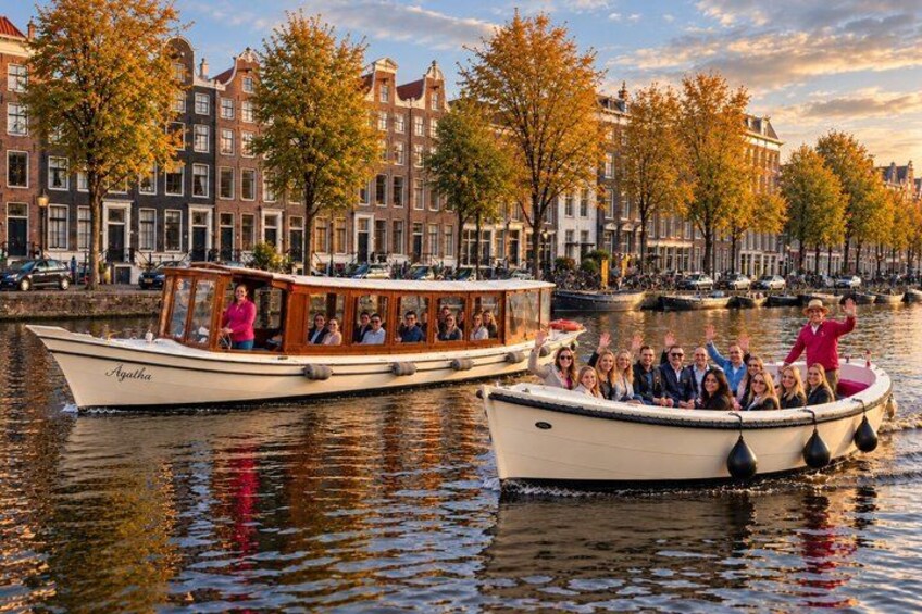 Two boats on a canal with buildings in the background. 1
