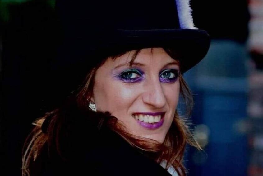 A person wearing a black hat with a white brim. 2