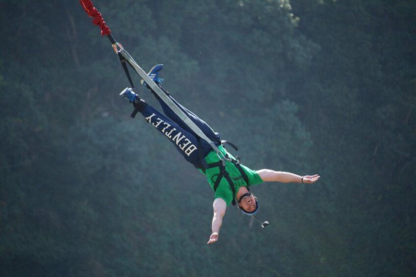 A person bungee jumping with a harness and a parachute. 2