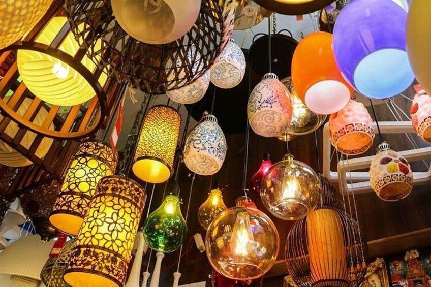 A variety of hanging decorative lamps with intricate patterns and designs. 2