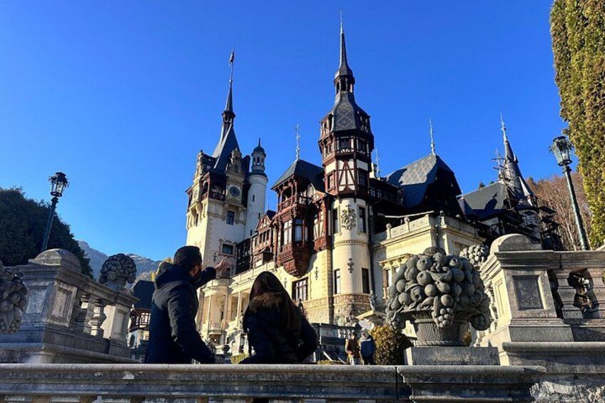 A historic castle with multiple towers and a large central building. 1
