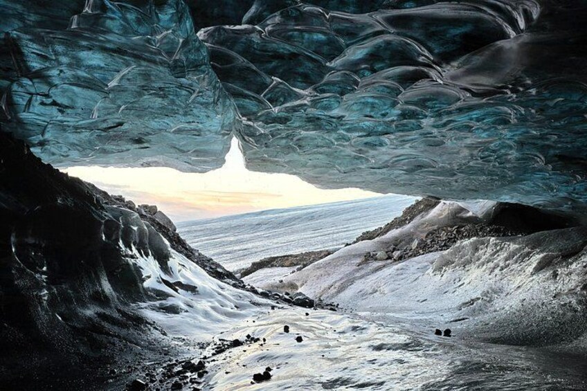 An ice cave with a view of the ocean. 2
