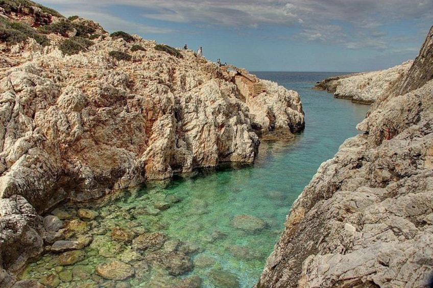 A rocky coastline with clear turquoise water. 3