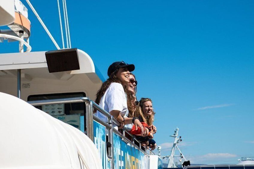 Guests enjoying stunning ocean views from the deck. 2