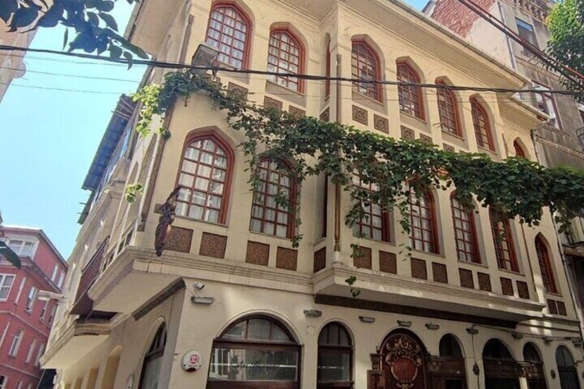 A historic building with arched windows and a decorative facade. 1