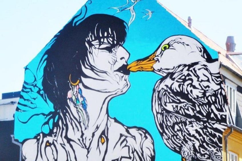 A mural with a person and a bird. 1
