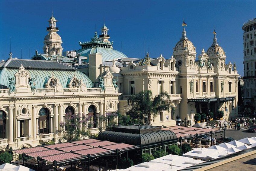 A grand, ornate building with domed roofs and intricate architectural details. 3
