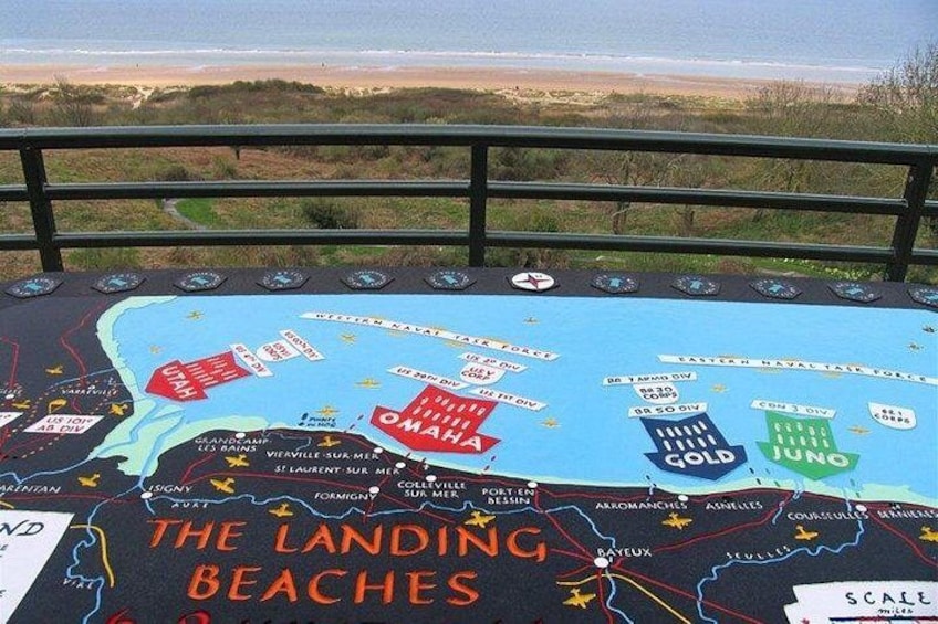 A map titled 'The Landing Beaches' with marked locations such as Omaha Beach, Gold Beach, and Juno Beach. 1