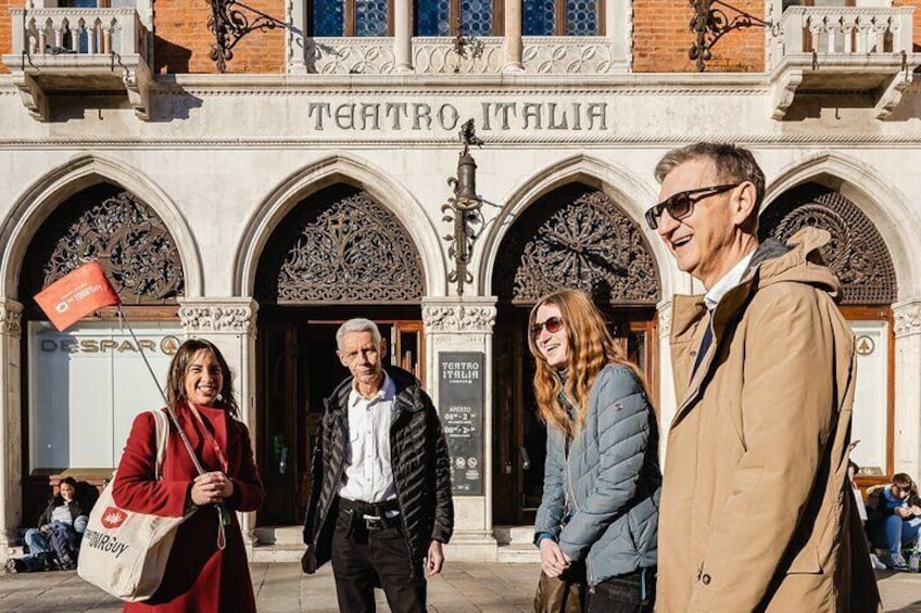 A building with ornate arches and the sign "TENTRO ITALIA". 3