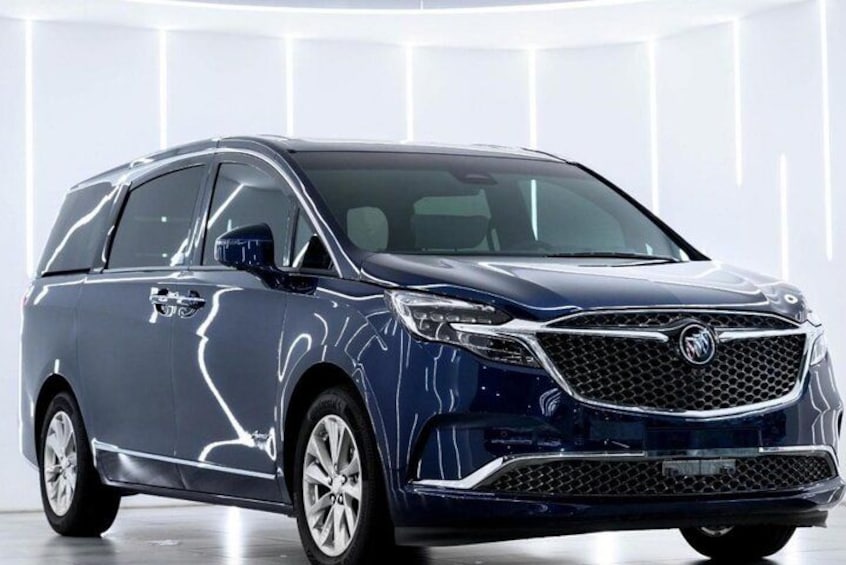 A blue minivan with a distinctive grille and alloy wheels. 3