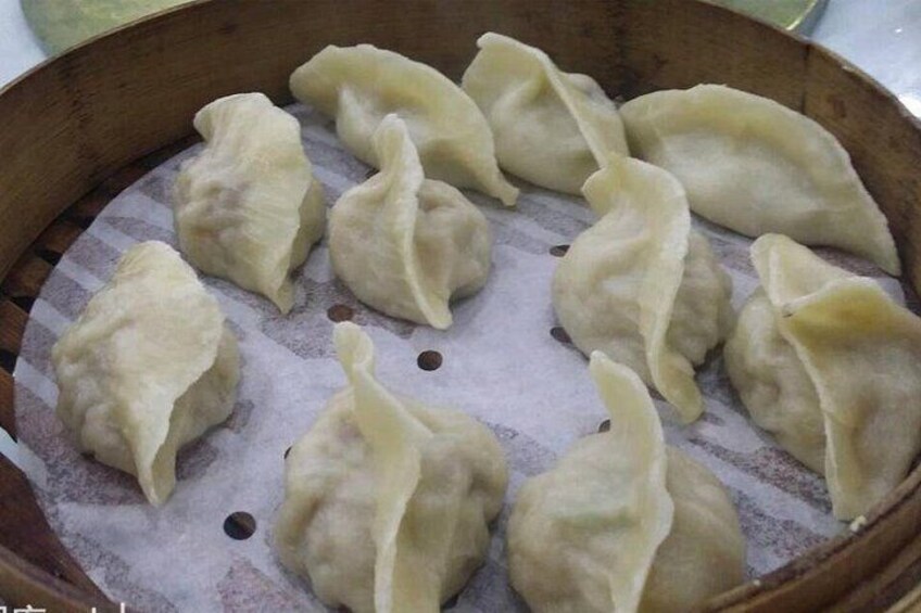 Een stoommandje met dumplings. 1