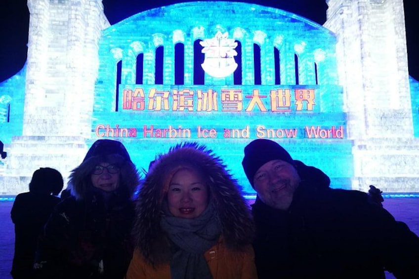A large illuminated sign with Chinese characters and the English text 'China Harbin Ice and Snow World.' 3