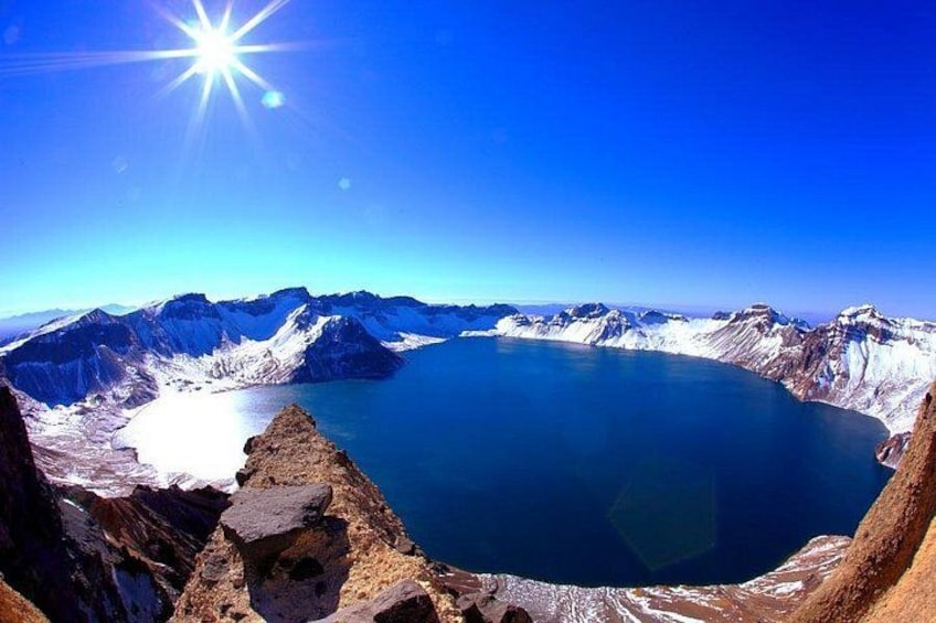 A mountain lake surrounded by rugged terrain. 1