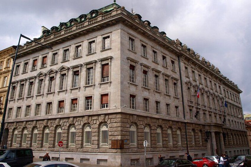 A large, historic building with multiple windows and a stone facade. 2