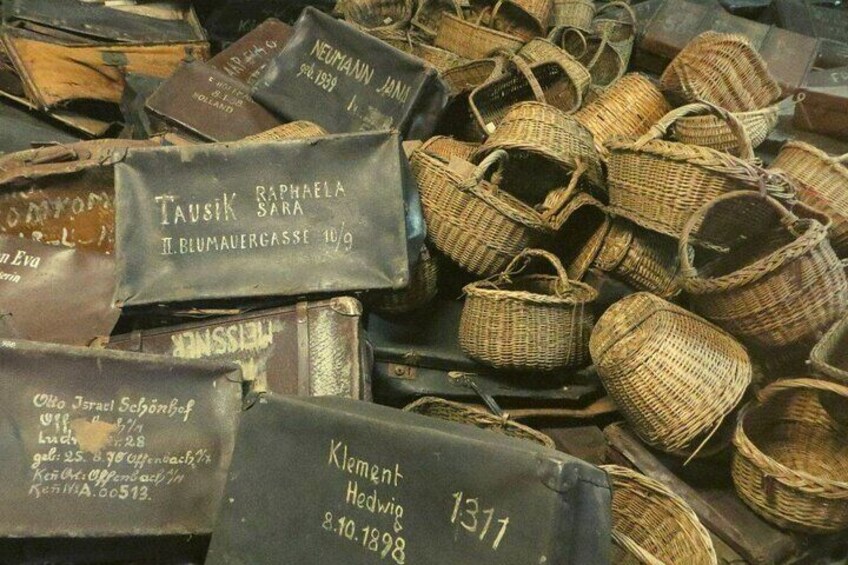 A collection of old woven baskets and metal containers with handwritten labels. 3