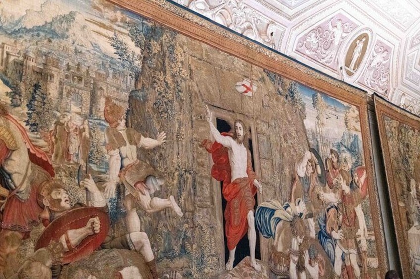 A fresco mural with religious figures, architectural elements, and a detailed landscape. 4