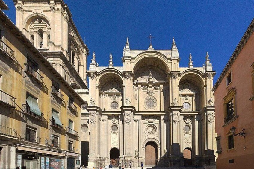 A historic cathedral with ornate architecture, including multiple arches and a prominent clock tower. 2