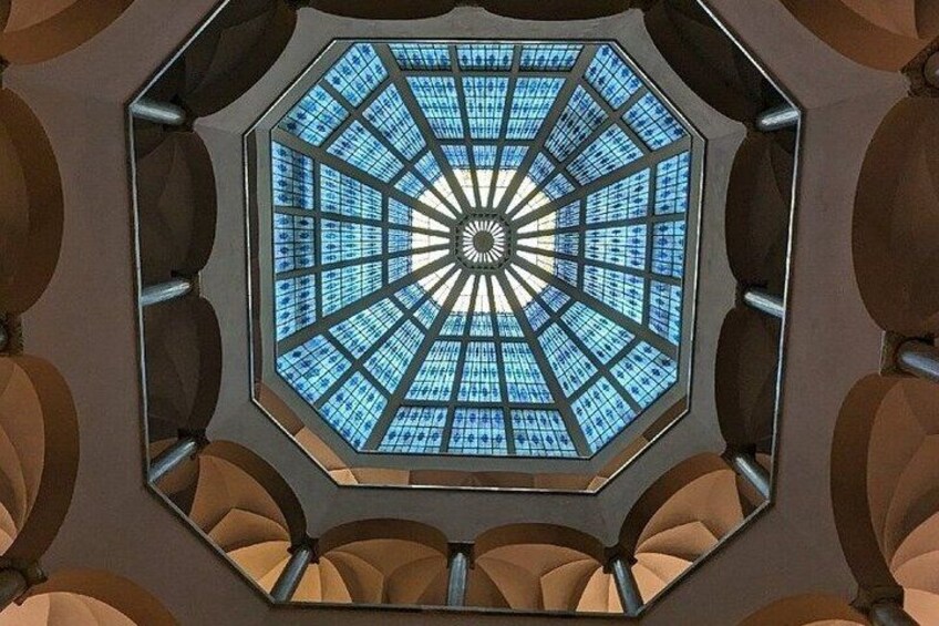 A large octagonal skylight with a radial pattern of glass panes. 2