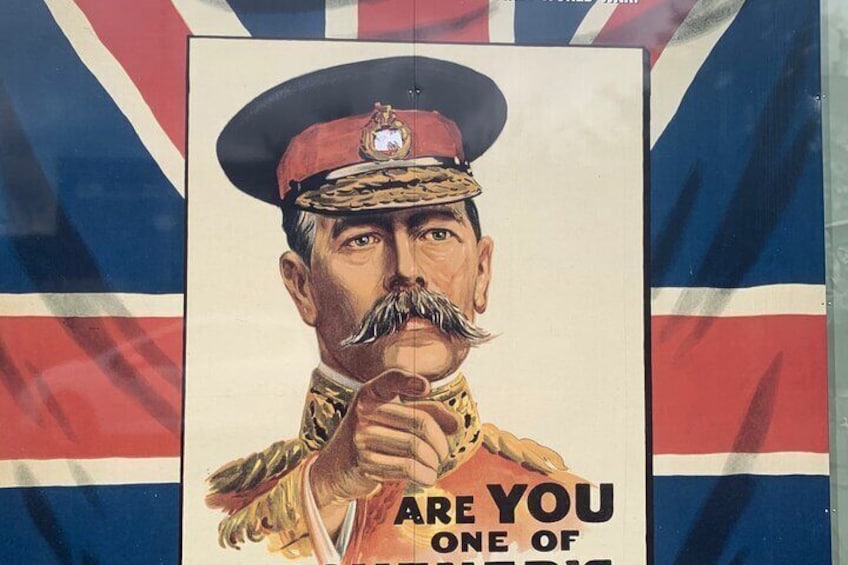 A poster with a man in military uniform and a flag in the background. 2