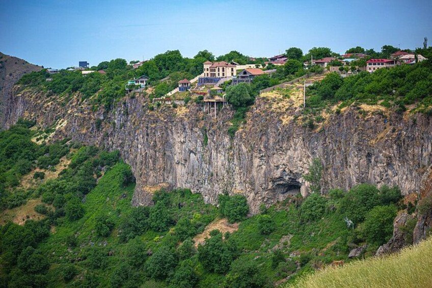A mountainous landscape with houses built on the hillside. 3