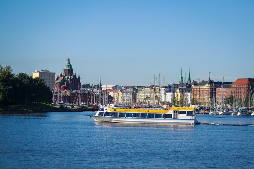 A river with a boat, a city skyline with historic buildings, and a prominent church with a green dome. 3