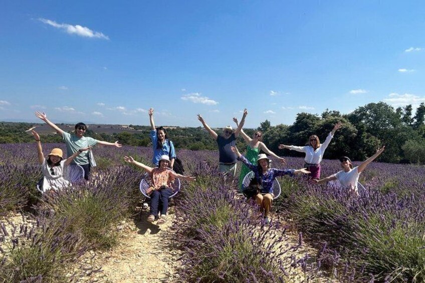 A group of people in a lavender field with a clear sky. 5